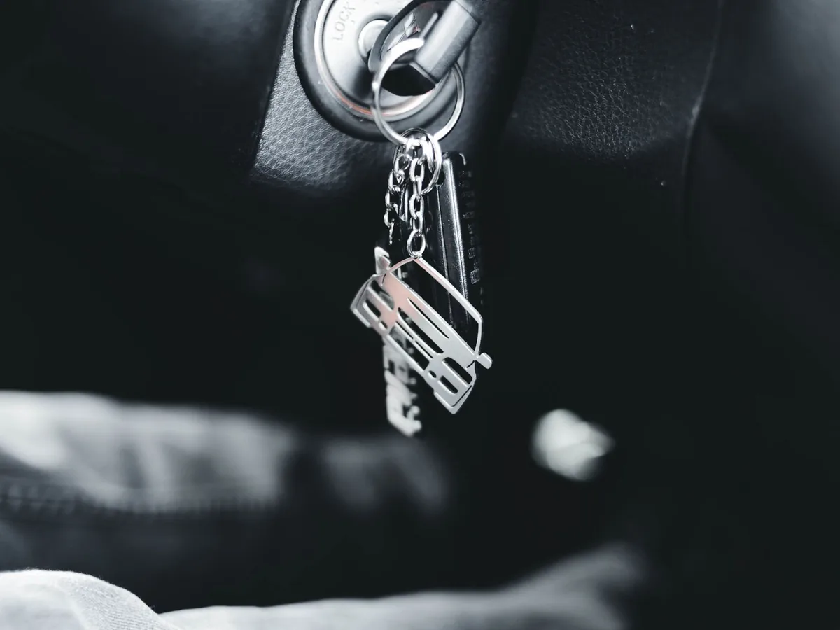 Car keys on a ring hanging from the ignition